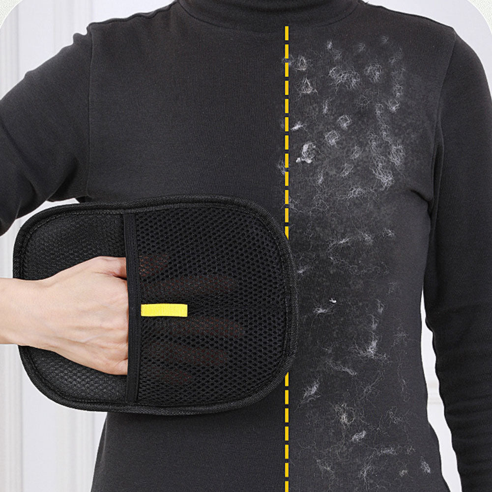 Dark sweater half wiped with the mitt: the wiped side is clear and the other side still has pet hair